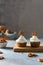Cupcakes with cream cheese and brezel and sprinkling sugar powder over them. Party, happy birthday, pastry, cookbook recipe,