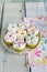 Cupcakes decorated with butter cream and marshmallow flowers