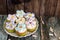 Cupcakes decorated with butter cream and marshmallow flowers