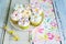 Cupcakes decorated with butter cream and marshmallow flowers