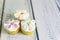 Cupcakes decorated with butter cream and marshmallow flowers