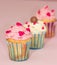 Cupcakes desert cream pink and white on pink background