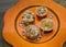 Cupcakes on orange plate with crystals