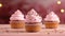 Cupcakes with pink cream on a wooden table, close-up, bokeh background. Generative AI.