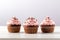 Cupcakes with swirled pink frosting. Generative Ai image