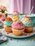 Cupcakes in vibrantly colors on a blur background