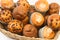 Cupcakes in a wicket basket on a white background