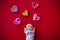 Cupid doll and heart-shaped on red background