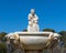 Cupid statue in the fountain of the Garden of Roses in Buen Retiro Park. Madrid