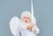 Cupid throws love arrow with bow for valentines day. Male angel in angelic wings. God of love.