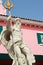 Cupids Statue - with pink buildings.