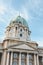 Cupola of the Buda Castle in Budapest, Hungary on vertical photo. Bottom view against the light sky. Historical castle and palace