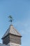 Cupola with Weather Vane Under Blue Sky