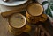 Cups with aromatic espresso on a wooden table, ceramic crockery