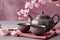 Cups of brewed tea, teapot and sakura flowers on grey table. Generative AI