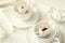 Cups with drip coffee bags on white table, closeup