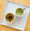 A cups of green tea on wood table background