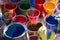 Cups of paint with many colors