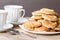 Cups of tea with almond biscuits with lemon