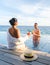 Curacao, couple man and woman mid age relaxing by the swimming pool during vacation in the Caribbean