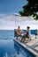 Curacao, couple man and woman mid age relaxing by the swimming pool during vacation, men and girl by pool in Curacao