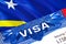 Curacao Visa in passport. USA immigration Visa for Curacao citizens focusing on word VISA. Travel Curacao visa in national