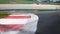 Curb close up on asphalt track motor sport detail selective focus