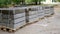 The curbstone lies on a pallet. The curbstone is prepared for road rement