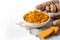 Curcuma powder in bowl and fresh turmeric root on white . Healthy spice immunity. Close up. Natural antiseptic