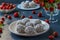 Curd balls with coconut shavings, strawberries and chocolate chip cookies located on a dark background, horizontal