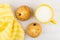 Curd biscuits with raisin, cup of milk, yellow napkin