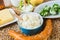 Curd in bowl, cream cheese, cheese ball with chive,emmental.