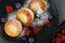 Curd fritter with berries in a plate. Cottage cheese fritters