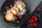 Curd fritter with berries in a plate. Cottage cheese fritters