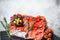 Cured meat platter of traditional Spanish tapas. Chorizo, jamon serrano, lomo and fuet. Gray background. Top view. Copy space