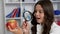 curious amazed teen girl in school uniform looking through magnifying glass at apple, curiosity