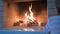 Curious baby girl passes by fireplace with fire.