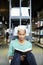 Curious black student reading book in library