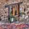 Curious flowerpots in a window