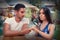 Curious Girl Testing Engagement Ring from Boyfriend with Magnifier