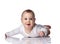 Curious happy infant baby boy toddler in diaper and white bodysuit is lying on floor on his stomach crawling