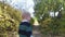 Curious little boy having walk in the park