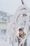 Curious little boy observing snow covered trees