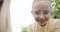 curious little girl examining an insect in her hand through a magnifying glass