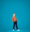 Curious Preteen Boy Looking Up With Interest While Standing Over Blue Background