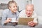 Curious senior couple using social media