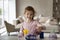 Curious smiling little girl playing with toy laboratory, chemistry experiments