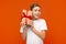 Curious teen boy checking gift, shaking present box