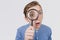 Curious Teenager with Magnifying Glass Isolated on the White Background