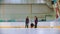 Curling training indoors - team group of three women leading the granite stone